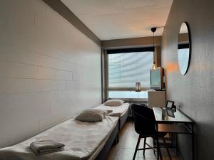 Katil atau katil-katil dalam bilik di Bella Hostel