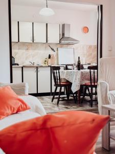 a kitchen and dining room with a table and chairs at Elena Apartment- Spacious for 6, 2 Bathrooms, Free Parking in Rovinj