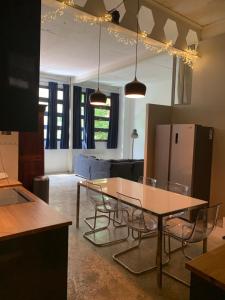 a kitchen and living room with a table and chairs at Design loft in Saint-Denis