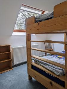 a bunk bed in a room with a window at Ty Madog in Cwm-y-glo
