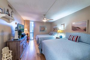 Et tv og/eller underholdning på Edgewater W208 Beach Bungalow Bliss