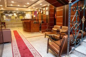 a waiting room with chairs and a podium in a store at Layali Al Tamayoz 2 in Jeddah