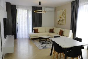 Coin salon dans l'établissement Cozy apartments Albania