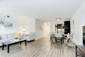 a living room with a couch and a table at 2BR Executive Apartment with Spacious Layout in Arlington