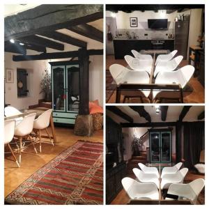 - un groupe de chaises et de tables blanches dans une pièce dans l'établissement Casa tradicional en Orozko, à Murueta-Orozko