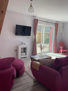 TV a/nebo společenská místnost v ubytování Casa Rosa