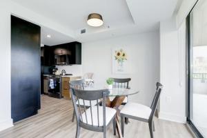 a dining room and kitchen with a table and chairs at 2BR Executive Apartment with Spacious Layout in Arlington