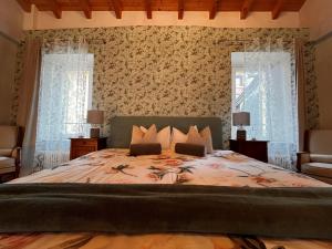 Postel nebo postele na pokoji v ubytování B&B Romantico Palazzo dei Ulivi