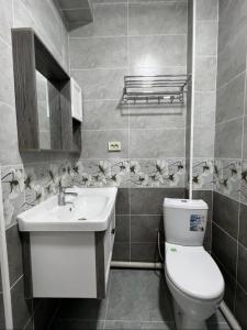 Ein Badezimmer in der Unterkunft Квартира на Мурас Ордо