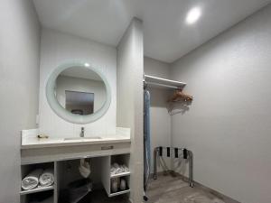 a bathroom with a sink and a mirror at Motel 6 Pasadena, CA Old Town Pasadena Area in Pasadena