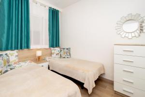 Posteľ alebo postele v izbe v ubytovaní Jose Hurtado Apartamento