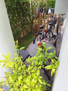 a couple of bikes parked next to a table and chairs at Sweet Harbour PORTO - Affittacamere in Pesaro