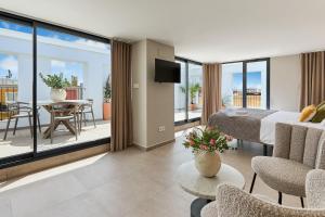 TV a/nebo společenská místnost v ubytování El Pont Alicante Apartments