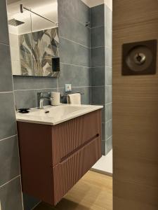 a bathroom with a sink and a mirror at Memo - Mediterranean Emotions in San Vito lo Capo +62 photos