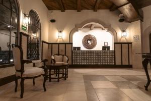 a room with chairs and a table in a building at Gran Hotel Mexico by Solaris in Tehuacán