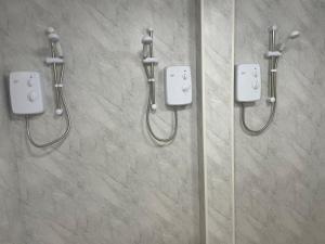 a shower in a bathroom with two at PartyPad Newcastle in Saint Peters
