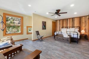 a bedroom with two beds and a ceiling fan at 736 1/2 B Main Street, Loft Studio in Ouray