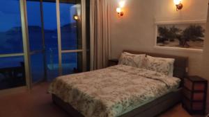 Posteľ alebo postele v izbe v ubytovaní Komissa΄s Beach House