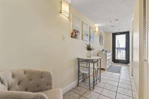 a living room with a couch and a table at Beautiful 2 Bedroom Apartment in Cherry Grove with Stunning Views Buena Vista 402 in Myrtle Beach