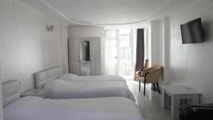 Postel nebo postele na pokoji v ubytování Mariam Hotel + 37 fotografií