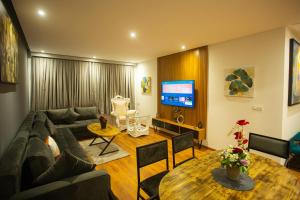 a living room with a couch and a table at ABM house in Tangier