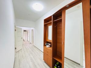 a room with a closet and a mirror at Супер квартира для большой семьи in Almaty