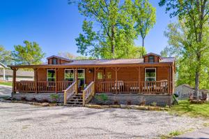a large log cabin with a large deck at Somerset Cabin, Close to Lake Access! in Somerset