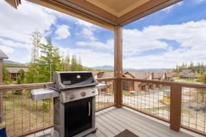 a grill on a deck with a view at Rendezvous 47 Lookout Point in Fraser