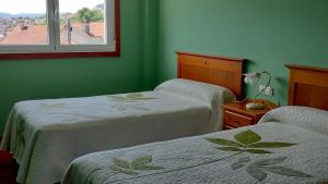 Posteľ alebo postele v izbe v ubytovaní Casa Ría de Vigo