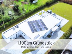 an overhead view of a house with a solar panel on it at Villa Heimat am Nationalpark in Allenbach
