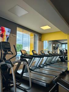 a row of treadmills in a gym at DM HOTEL in Propriá