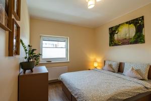 Ein Bett oder Betten in einem Zimmer der Unterkunft Apartamenty u Romy - Mocha