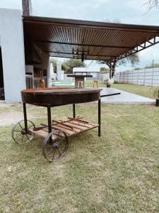 a ping pong table sitting in the grass at Finca Amankay con alojamiento para 5 personas in Santiago del Estero