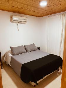 Ένα ή περισσότερα κρεβάτια σε δωμάτιο στο Finca Amankay con alojamiento para 5 personas
