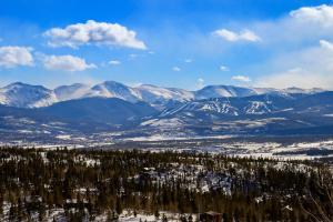 a snowy mountain range with trees and snow covered mountains at 273 Fallen Rock in Tabernash +41 photos