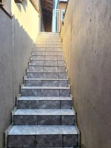 a stairway with steps leading up to a building at Suites do Rafa Ubatuba in Ubatuba