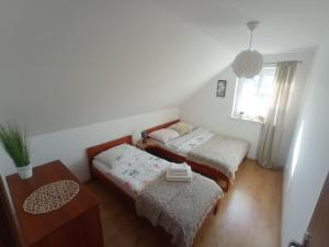 Posteľ alebo postele v izbe v ubytovaní Domki Wichrowe Wzgórze Bieszczady