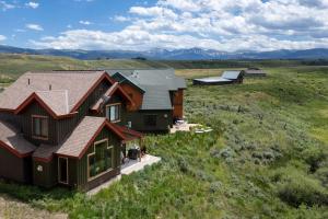 an aerial view of a house in a field at 2002 Lupine Lane in Tabernash