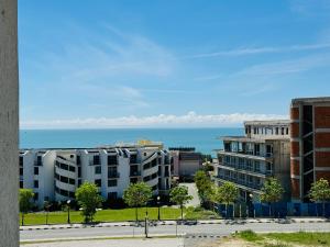 a view of the ocean from an apartment building at VODENICATA 7 Apartment Sveti Vlas in Sveti Vlas