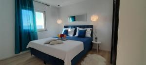 Postel nebo postele na pokoji v ubytování Apartments San Paulo