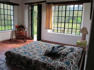Voodi või voodid majutusasutuse Reserva natural Naranja, Café y Pimienta toas