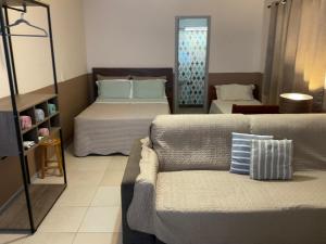 Postel nebo postele na pokoji v ubytování Loft no Recreio