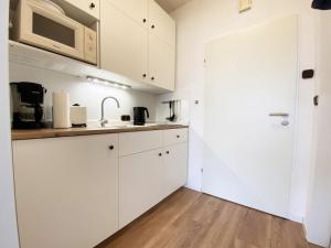 Η κουζίνα ή μικρή κουζίνα στο Ferien im Wangerland - Haus Wiesenweg - Apartment 3 1OG