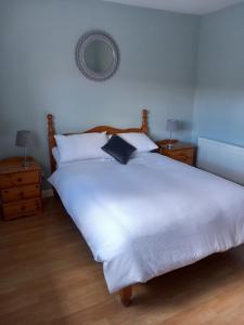מיטה או מיטות בחדר ב-Lake View House