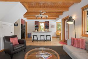 a living room with a couch and a table at 383 County Road 508 by Stay Winter Park in Fraser +23 photos