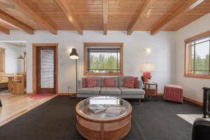 a living room with a couch and a table at 383 County Road 508 by Stay Winter Park in Fraser