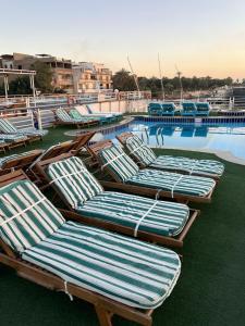 The swimming pool at or close to Queen Isis floating hotel