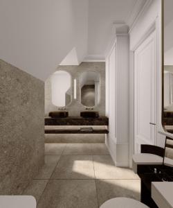 un pasillo con espejos en una habitación blanca en Park Lane Copenhagen, en Hellerup