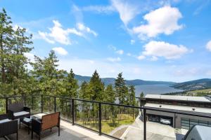a balcony with a view of the water at Luxury Home with Amazing Lake Okanagan Views in Kelowna