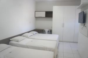 Uma cama ou camas num quarto em Pousada Costa do Calhau